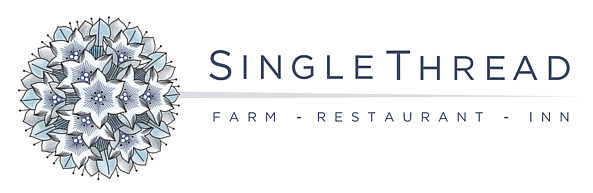 Logo for SingleThread Farm, Restaurant, and Inn with a blue floral design on a green background.